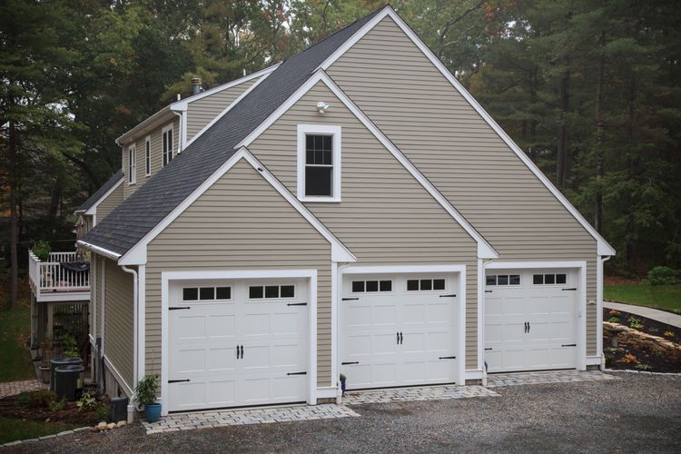 Carriage house garage doors on big house